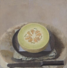 Melon Sliced Open on a Black Plate with Knife
